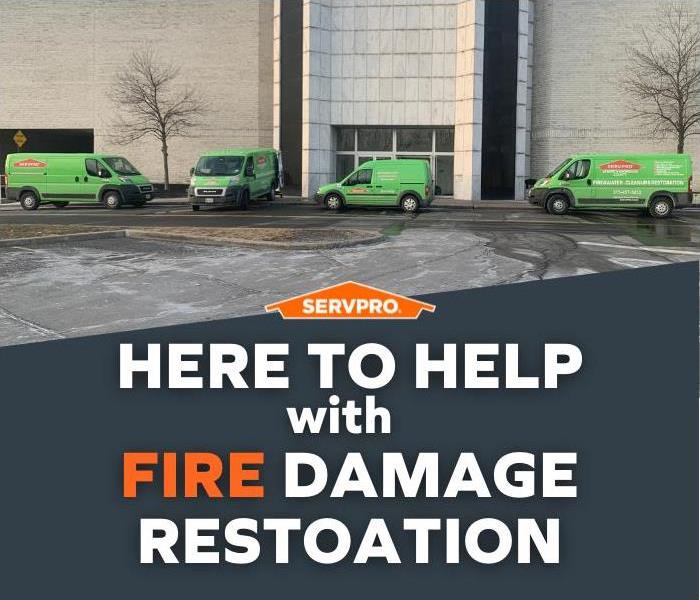 SERVPRO vehicles in front of a building with the caption “Here to Help with Fire Damage Restoration.”